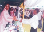 Wife of Bayelsa State Governor, Mrs Alanyingi Sylva (left) presenting a gift to a  child at the 2009 Children’s Day celebration in Yenagoa, Bayelsa State.