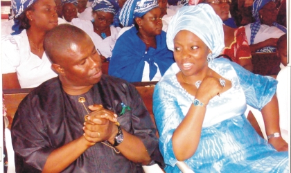 Wife of Rivers State Governor, Dame Judith Amaechi (right) conferring with Commissioner for Works, Engr Dakuku Peterside, during the  church service of Mrs Boma Nseigbe at St Thomas Anglican Church, Diobu, Port Harcourt, recently. Photo: Obinna Dele Prince.