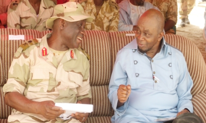 Nigeria Defence Academy (NDA) Commandant, Maj-Gen. Mahmud Yerima (left) discussing with Senate Leader, Tunde Akogun at the NDA Desert Warfare Cadets Training in Yusufari, Yobe State, last Saturday.