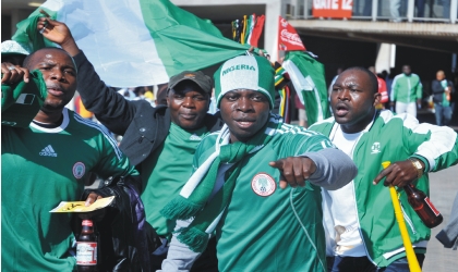 Nigerians in South Africa cheering the Super Eagles, during their 2010 FIFA World Cup Group B match against Argentina, last Saturday.