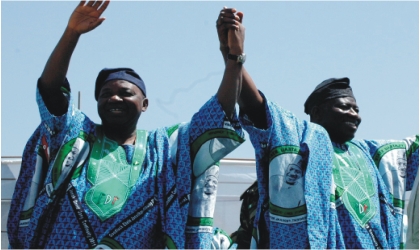 President Goodluck Jonathan (right) and Vice President Namadi Sambo, acknowledging cheers in Jos during the PDP presidential campaign, yesterday