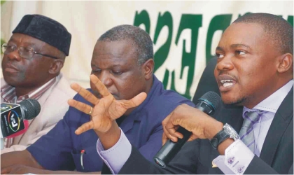 From right: TUC President, Comrade Peter Esele, NLC President, Comrade Abdulwaheed Omar, and NLC Deputy President, Comrade Promise Adewusi, at a news conference on the implementation of national minimum wage in Abuja, yesterday