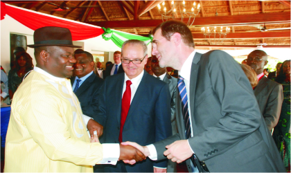 Rivers State Deputy Governor, Engr. Tele Ikuru (left), in a handshake with the deputy Managing Director, Port Harcourt, Total Exploration and Production, Nigeria, Mr. Dennis Berthelot, while, the French Ambassador to Nigeria, Mr. Jean Michel-Dummond, watches delightfully.