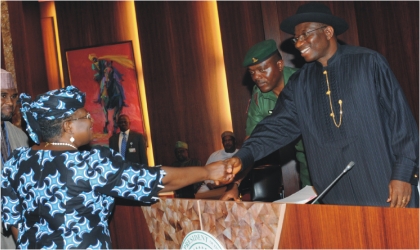 Dr Ngozi Okonjo-Iweala , Minister of Finance  being congratulated by President Goodluck Jonathan after taking  her oath of office in Abuja last Wednesday