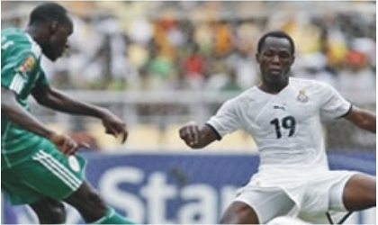 Super Eagles player (left) in a tango with Black Stars player yesterday at Vicarage during an international friendly match. The game ended 0-0