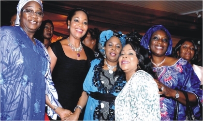 First Lady, Dame Patience Jonathan (middle), flanked by Uche Ekwunife (right ), Nkiru Onyejiocha (left) and other National Assembly women members during a dinner party in Abuja, on Wednesday.