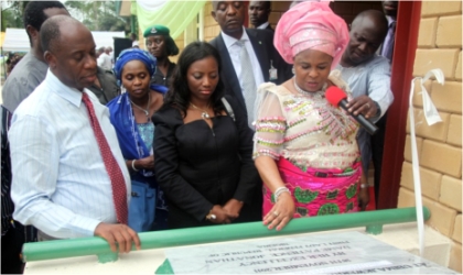 First Lady, Dame Patience Jonathan (right) commissioning an Empowerment Support Initiative(ESI) model nursery school while Rivers State Governor, Rt. Hon. Chibuike Rotimi Amaechi (left) and his wife, Founder of ESI, Judith watch, in Ubima, Rivers State, over the weekend.