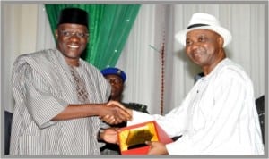 Vice President, Namadi Sambo (right), presenting an award to Governor Abdulfatai Ahmed of Kwara State during the 2013 World Teachers’ Day celebration in Abuja last Saturday