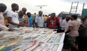 Free readers debating issues reported in newspapers displayed at a vendor stand at Alwell Bus Stop, Umuwaya Road, Umuahia, recently.