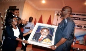 Senator representing Rivers South East Senatorial District in the National Assembly, Senator Magnus Abe (right), receiving a portrait from a beneficiary, Barrister Waamene Nwineewii, during the presentation of grants to his constituents proceeding to the Law School in Port Harcourt, last Monday.