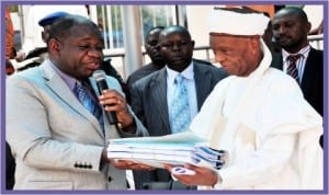 Minister of Power, Prof. Chinedu Nebo (left), handing over Abuja Distribution Company to the Chairman, New Core Investor, KANN Consortium Utility Company Ltd, Alhaji Shehu Malami, in Abuja  last Friday