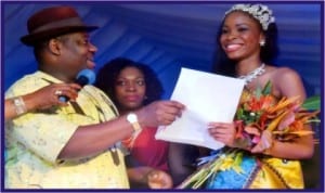 Rivers State Deputy Governor, Engr Tele Ikuru, presenting car particulars and key to the winner of 2013 Miss Port Harcourt Centenary Beauty Pageant, Miss Theodora Kelechi Atako (right), at Hotel Presidential, Port Harcourt, last Friday. With them is wife of the Deputy Governor, Mrs Mima Ikuru. Photo: Nwiueh Donatus Ken