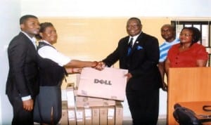 Special Adviser to the Rivers State Governor on ICT, Engr Goodlife Nmekini (middle), presenting computers to Executive Director, Keeping It Real Foundation, Mrs Bitebo Gogo (2nd left), while other personalities watch in Port Harcourt, yesterday. Photo: Egberi A. Sampson