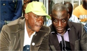 Rivers State Commissioner for Special Duties, Barr Dickson Umunakwe (left), conferring with Chairman, Mile One Market Traders Association, Deacon Kenneth Eze, during a public sensitisation programme on Fire, Safety and Prevention, organised by the state Ministry of Special Duties, last Monday. Photo: Egberi  A. Sampson