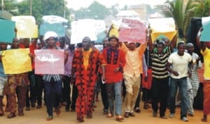 Youths from Ezinano community of Awka protesting the alleged sale of their land by land speculators in Awka, yesterday.