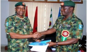 Outgoing Commander of the Joint Task Force (JTF) in the Niger Delta, Maj.-Gen. Batta Debiro (left), handing over to his successor, Maj.-Gen. Ilyasu Abbah at JTF’s Headquarters in Yenagoa, Bayelsa State, last Friday