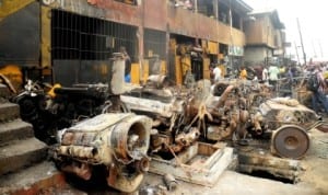 An aftermath of a fire incident which razed several shops, offices, vehicles and equipment at Olodi Apapa in Lagos On Tuesday Night (7/1/14).