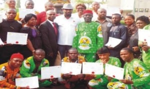 New chairman, Nnewi South Lga, Chief Ossy Iyiegbu (5th right), outgoing chairman, Mr Chieloka Okoye (4th left),  deputy chairman, Mr Okey Abazu (3rd left) and newly sworn-in councilors in Ukpo,  Nnewi South, Anambra State, last Wednesday. Photo: NAN