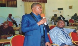 Deputy Speaker, Rivers State House of Assembly, Hon Leyii Kwanee (standing), throwing questions to Rivers State Commissioner for Finance, Dr Chamberlain Peterside over the N300 billion Bond requested by the State Governor at the sitting of the House at Government House, Port Harcourt  yesterday. With him are Hon Golden Chioma (right) and another lawmaker (right). Photo: Chris Monyanaga