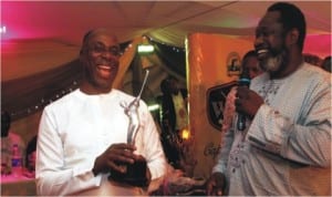 Rivers State Governor, Rt Hon. Chibuike Amaechi  (left) receiving a prize from out-going Captain of Ikeja Golf Club, Wole Sowole during the Ikeja Golf Club Captain’s Day 2014 celebration in Lagos at the weekend