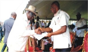 Rivers State Governor, Rt. Hon. Chibuike Amaechi, receiving an address from Chairman NLC Rivers State, Comrade Chris Oruge, during the May Day celebration in Port Harcourt, yesterday.