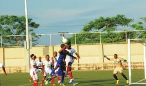 Sharks player contesting the ball on air with Enugu Raigers during a Premier League match in Port Harcourt last Wednesday.