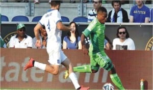 Super Eagles Striker, Emmanuel Emenike taking on a Greece defender in their friendly match early today. The encounter ended goalless