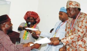 L-R: Antiquities Vendor, Mr Umaru Yusuf, Director of Museum, National Commission for Museums and Monuments (NCMM), Ms Rosemary Bodam, Director-General, NCMM, Mr Abdallah Usman and Minister of Culture, Tourism and National Orientation, Chief Edem Duke, at the presentation of payment advice to antiquities vendors in Abuja last Friday