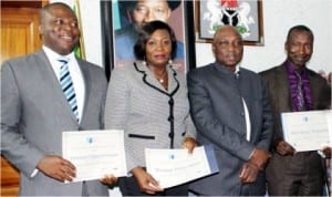 L-R: Chief of Staff to the Managing Director, Federal Airports Authority of Nigeria (FAAN), Mr Kabir Mohammed, Mrs Vivian Menyanga of the Training Department and Mr Emmanuel Chidera, Airport Operations Department, who were presented certificates by the Managing Director, FAAN, Mr Saleh Dunoma (2nd right), for having graduated in Airport Management Professional Accreditation Programme which certifies them as Airport Managers.