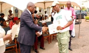 Corper Thomas Abasiama receiving an award