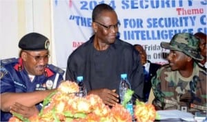  From Left: Commandant, Nigeria Security and Civil Defence Corps (Nscdc) Enugu State, Mr Nathaniel Ubong, representative of Enugu State Government, Mr Chime Richard and representative of Commandant,  Nigerian Army 82 Garrison, Capt. Umar Garba, at the Nscdc 2014 Security Summit in Enugu last Friday. Photo: NAN