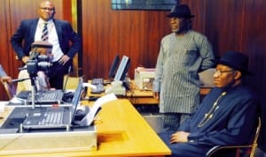 President Goodluck Jonathan(right),  during the capturing of his biodata at the official launch of new e-passport in Abuja last Wednesday. With him is Minister of Internal Affairs, Mr. Abba Moro (2nd right). Photo: NAN