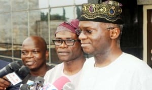 Governor  Babatunde Fashola of Lagos State  (right), speaking to newsmen on Ebola Virus on his arrival from Lesser Hajj in Lagos recently.  With him are his Special Adviser on Media, Mr Hakeem Bello (left) and  Commissioner for Information and Strategy, Mr Lateef Ibirogba.