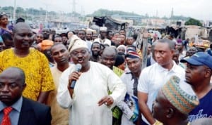 Gov Abiola Ajimobi of Oyo State addresing traders during his visit to Aleshioloye Market which got burnt in Ibadan last Saturday. Photo: NAN