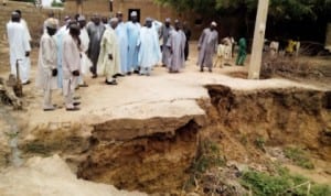 Jigawa State  government officials inspecting a landslide caused by flood in Taura Local Government Area, recently. Photo: NAN