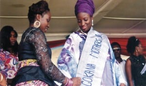 Wife of the Senator representing Rivers South-East Senatorial District, Mrs Bariyaa Abe (left) decorating the wife of the Governor of Rivers State, Dame Judith Amaechi, during her visit to Gokana LGA, recently. Photo: Chris Monyanaga