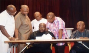 L-R: Hon Josiah Olu, Hon. Chidi Lloyd, Speaker of the House, Rt Hon. Otelemaba, Amachree (middle sitting), Hon. Augustine Ngo (3rd right), Hon. Victor Amadi (2nd right) and Deputy Clerk, Mr. Lekie Dumnu, during the passage of the 2015 State Budget in Port Harcourt last Wednesday.                                                          Photo: Chris Monyanaga