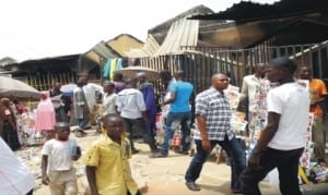 Some Traders at a burnt market in Hong, Adamawa State, during a media tour of territories recovered by Nigerian troops from insurgents in Hong. 