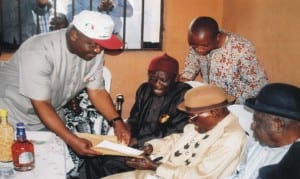 Governship candidate, of  Peoples Democratic Party (PDP), Rivers State, Chief Nyesom E. Wike (left), presenting a car document to the Paramount Ruler  of Rumuwoji community, Chief John Dike in the community, yesterday .                                                                                                                                                                     Photo: Obinna Prince Dele.