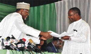 INEC collation officer for Rivers State, Prof. John Etu-Efeotor, handing over the results sheet of the presidential election in the state to INEC Chairman, Prof. Attahiru Jega, at the National Collation Centre in Abuja, yesterday.