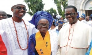 Parish Priest, St. Joseph Pro-Cathedral Catholic Church, Msgr. Stephen  Uzomah (right) congratulating Mrs Florence Okonta, after her conferment of Mothers  Faith (Ezinne Okwukwe), by the Catholic Women Organisation in Asaba, Delta State. With them is Chief Executive, Fred Okonta and Co. Chattered  Accountants, Chief Fredrick Okonta.