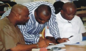 Leader of the House, Hon Chidi Lloyd (left) conferring with chairmen House Committee on Judicary, Hon Golden Chioma (middle) House Committee on Finance, Hon Josiah Olu (right) during the sitting of the house, recently.  Photo: Chris Monyanaga