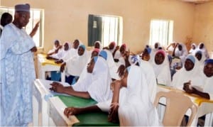 Governor  Atiku Bagudu of Kebbi State (left) interacting with students of the Government Girls Secondary School Bunza,  during his visit to the school, last Friday.