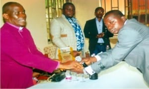 Bishop, Niger Delta Diocese, Rt Rev Ralph Ebirien (left) receiving the award from WASU representative while others look on.