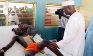 Former Governor of Adamawa State, Mr Bala Ngillari  (right), sympathising with a victim  of the recent Jimeta Market bomb blast at the Federal Medical Centre in Yola, recently.