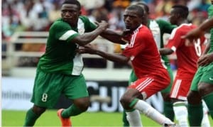 Dream Team VI’s Oghenekaro Etebo (8) being checked by a Congolese player, during the first leg of the pre-Rio 2016 Olympic qualifier in Port Harcourt, two weeks ago.