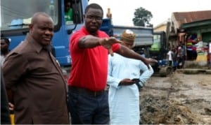 Governor Nyesom Wike of Rivers State (left), with Julius Berger site Engineer, Emmafedo , briefing the governor on the level of work on Nkpolu-Rumuigbo road in Port Harcourt, during an inspection recently.