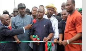 Governor Nyesom Wike of Rivers State (middle), Chairman, Caretaker Committee, Akuku-Toru LGA,  Hon. Odimabo Torukwein (right),former Commissioner for Works, Chief David  Briggs (2nd left) and former Minister of Sports, Hon. Tammy Danagogo (3rd right), during the commissioning of Abonnema/Obonoma Bridge in Abonnema, yesterday. Inset is the bridge