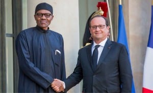  President Muhammadu Buhari (left), being welcomed by President Francoise Hollande of Franc at the Elysee Palace in Paris recently.