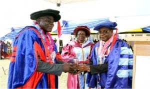 Senior Special Assistant on Administration to the Deputy Governor, Barr. Gilbert Nria (left), receiving an Award of Fellows of the Rivers State College of Health Science and Technology on behalf of the deputy governor from the Acting Provost of the College, Dr. Nnamdi Amadi, at the 15th convocation ceremony of the college in Port Harcourt recently. With them is the Registrar, Mrs Patricia Lawson